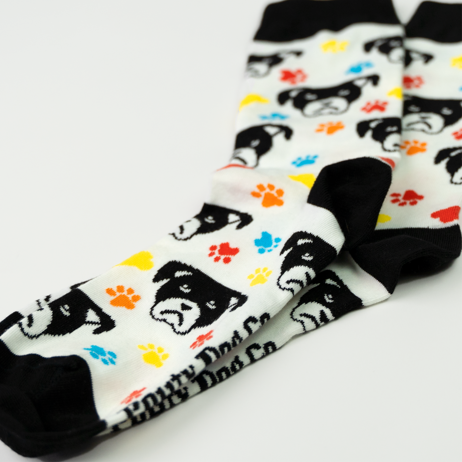 Paws and Pouts Sock that have a soft feel with enough stretch to get you through each day.  Who would not like this pouty dog face and colourful paws?
